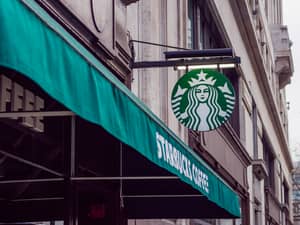 A Starbucks logo on a cafe