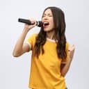 Woman passionately singing into a microphone