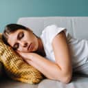 Woman napping on sofa
