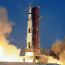 The Saturn V space vehicle launching, the historic Apollo 11 mission.