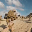 Soldiers in desert camouflage running in the field