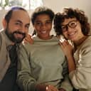 A joyful family with an adopted daughter taking a selfie portrait.