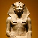 A statue of a pharaoh carved from stone