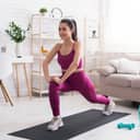 Woman doing yoga on a mat indoors