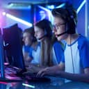 a team of teenage gamers participating in an eSports tournament