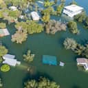 tons of homes totally destroyed , flooded and submerged under water , Historic Flooding aerial drone view above Homes and Houses Central Texas Flooding severe weather and climate change flooding