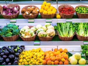 A supermarket stall cooling rack with vegetables