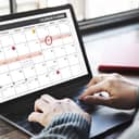 Person checking their schedule on laptop