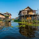 Wooden houses over the waters of Inle Lake in Shan State, Myanmar.