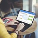 A woman chatting on a laptop using a chat app