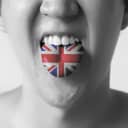 Great Britain flag painted in tongue of a man - indicating English and British language and speaking in Black and White tone