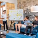 Businessmen discussing things on a whiteboard