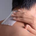 Medicated pain relief patch with man pain neck,office syndrome,Health problems from overworked concept