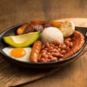 Colombian Bandeja Paisa from Antioquia region, served on a black plate.
