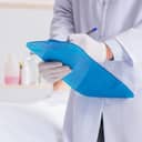 A police coroner conducts a thorough autopsy of a deceased individual in the morgue.