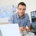 An IT specialist working on a computer hardware