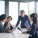 A group of coworkers having a meeting in an office