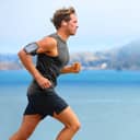 Man jogging by the lake