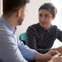 A man and woman talking to each other