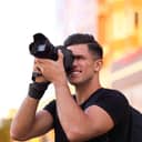 Man taking a photo with a professional camera