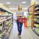 Woman browsing through a supermarket aisle