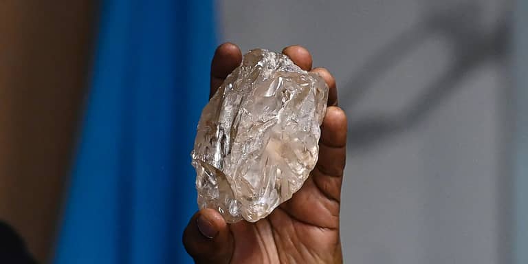A person holds a 2,492-carat diamond which was found in the country and on show, in Gaborone, Botswana, Thursday, Aug. 22, 2024. 