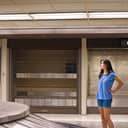 Woman waiting alone at an empty conveyor belt