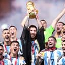 Lionel Messi of Argentina lifts the FIFA World Cup trophy in 2022.