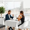 a couple sitting in a luxury restaurant