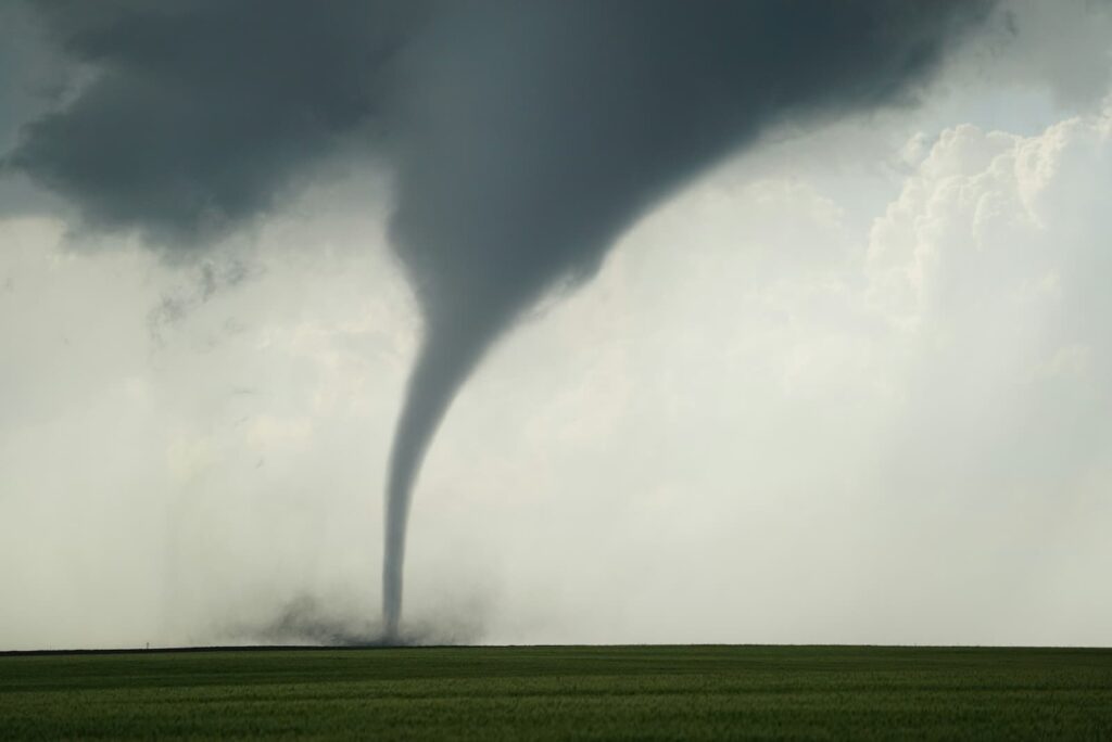 A large tornado in a flat, rural area