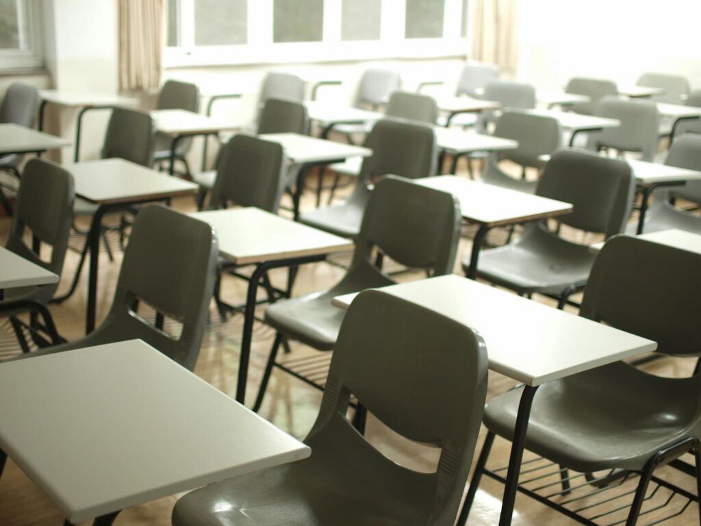 Desks and chairs lined up in a classroom