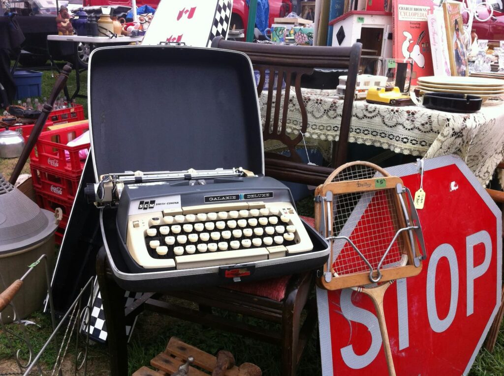 A variety of used items for sale at a flea market