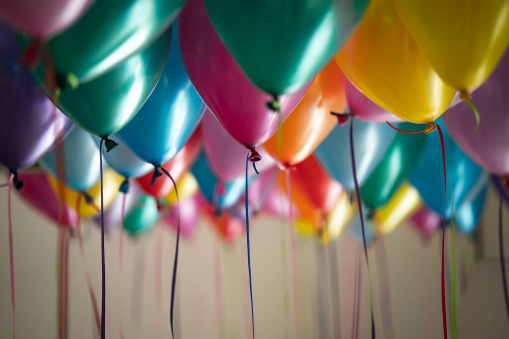 Many colorful birthday balloons