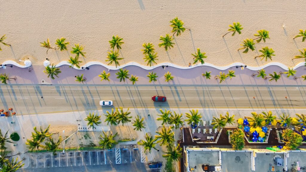 Cars driving on a beachside Miami street on a sunny day