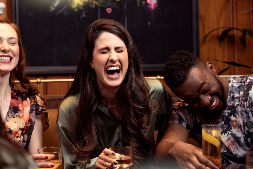 British and American people laughing at a funny joke
