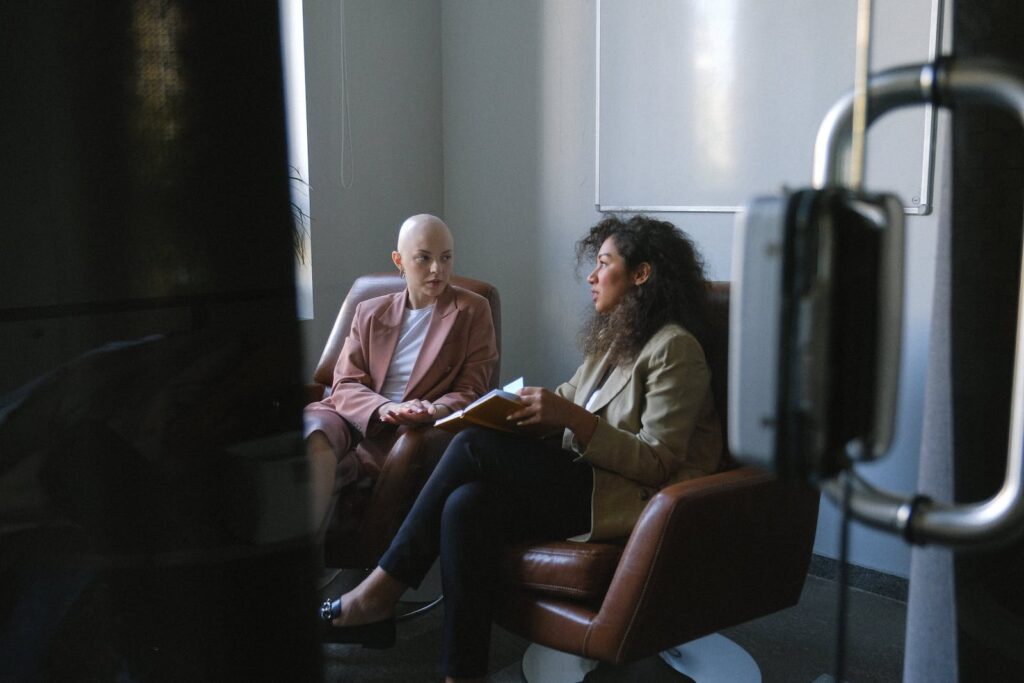 Two women discussing an important business agreement