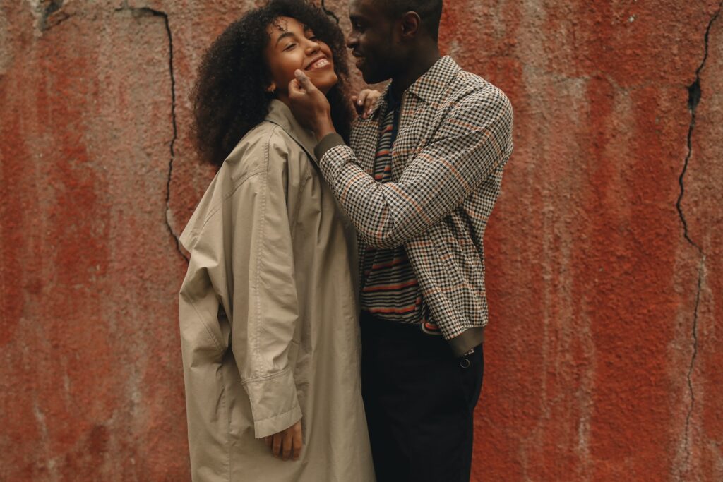 A young couple in love, smiling and embracing each other