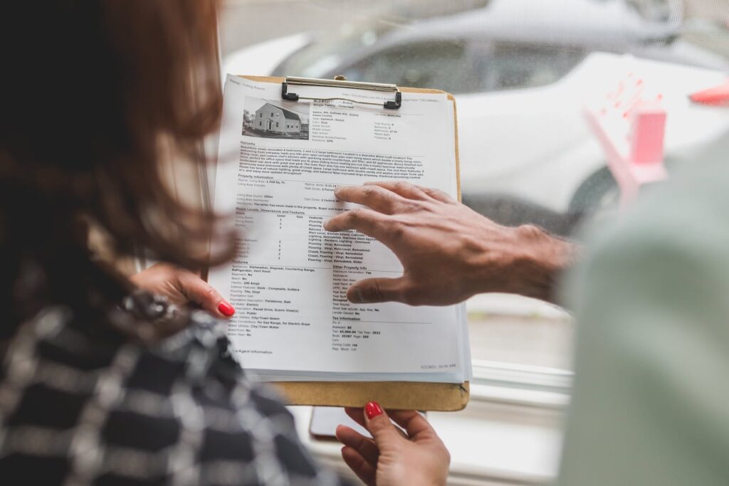 Two people looking carefully at an important contract