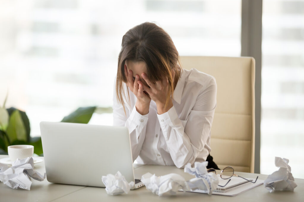 An English language student feeling frustrated by constantly trying to avoid making mistakes in her conversations