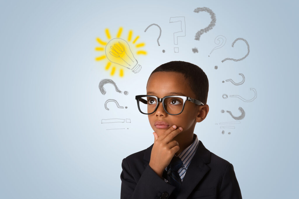 A very intelligent young boy thinking deeply