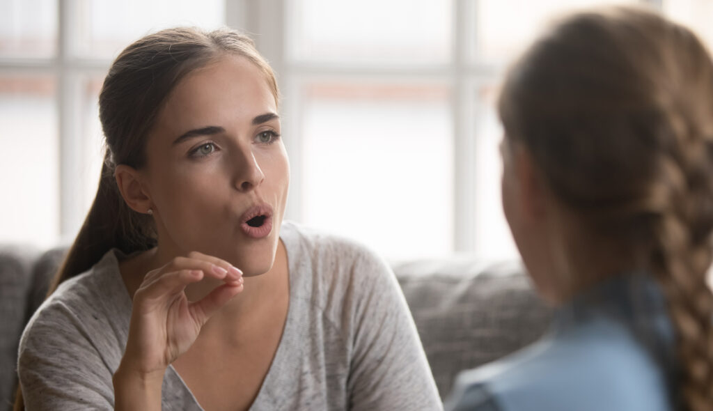 A woman correcting someone's English pronunciation