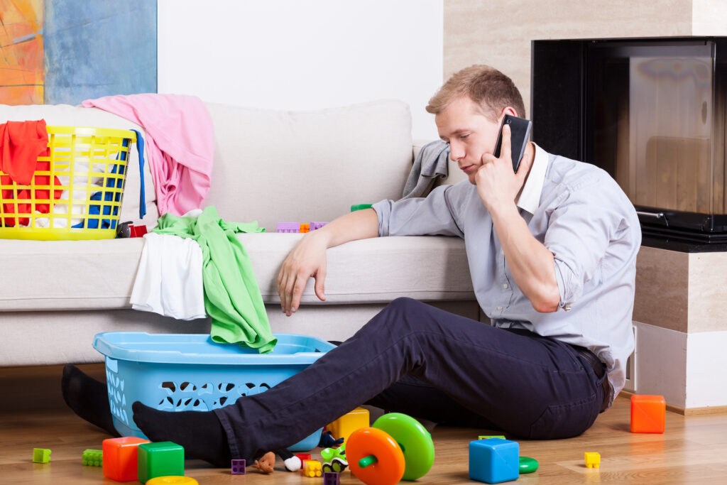 A tired businessman calling someone to reschedule a meeting