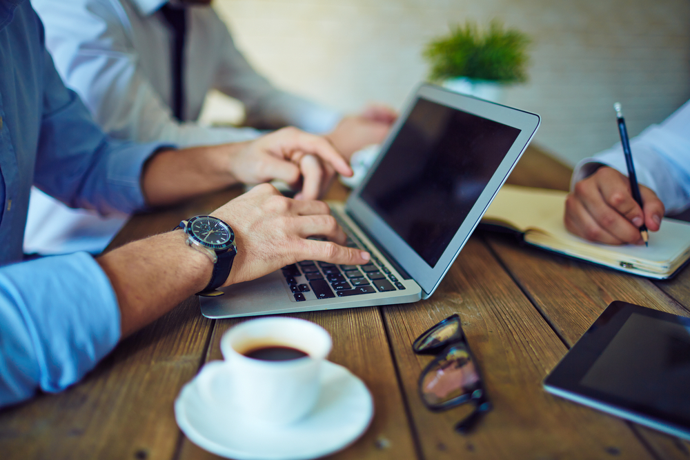 Businesspeople working together and communicating in formal English