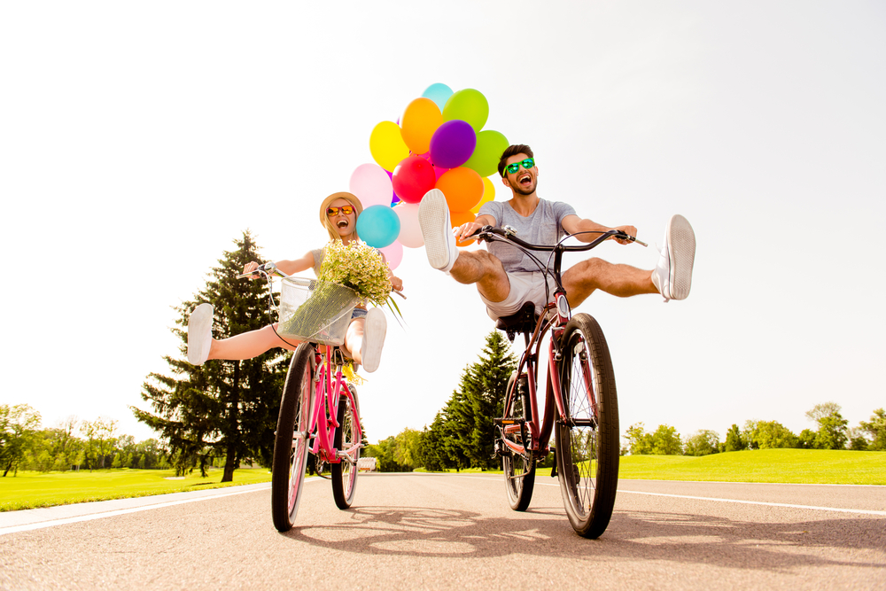 A woman and a man going on an unusual bike ride